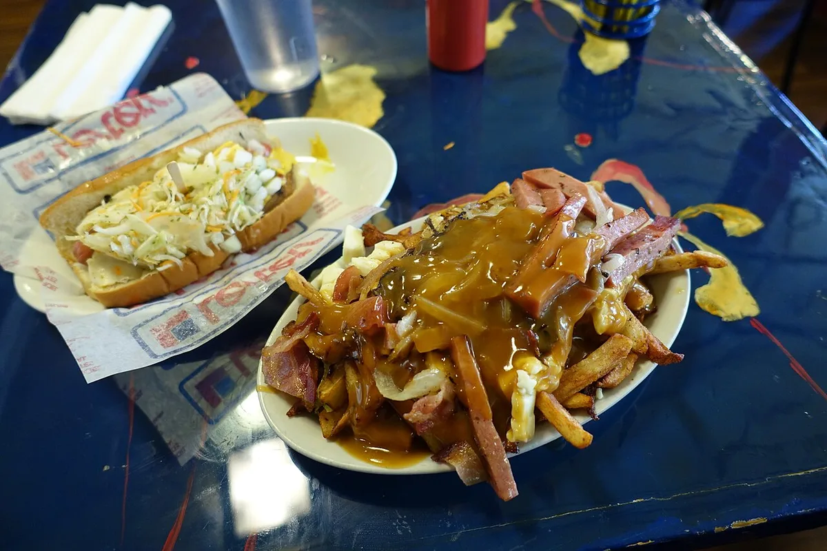 Poutine and a steamé at La Banquise, Montreal