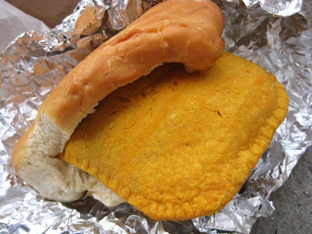 A Jamaican beef patty tucked into coco bread