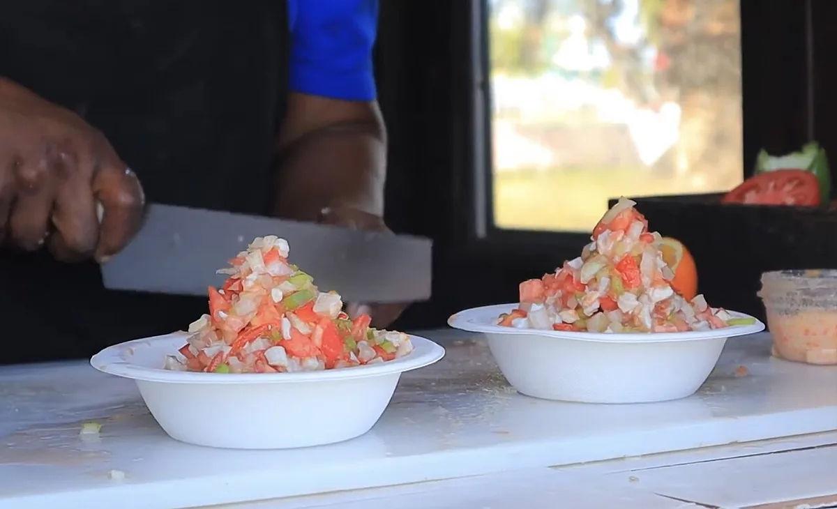 Conch salad chopped to order at a stall, Bahamas