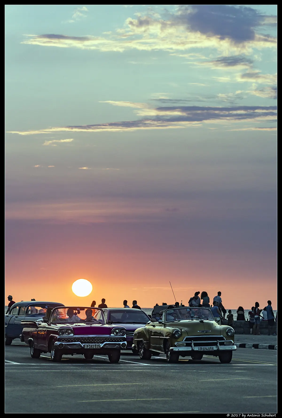 Classic cars on the Malecon at sunset, Havana, Cuba