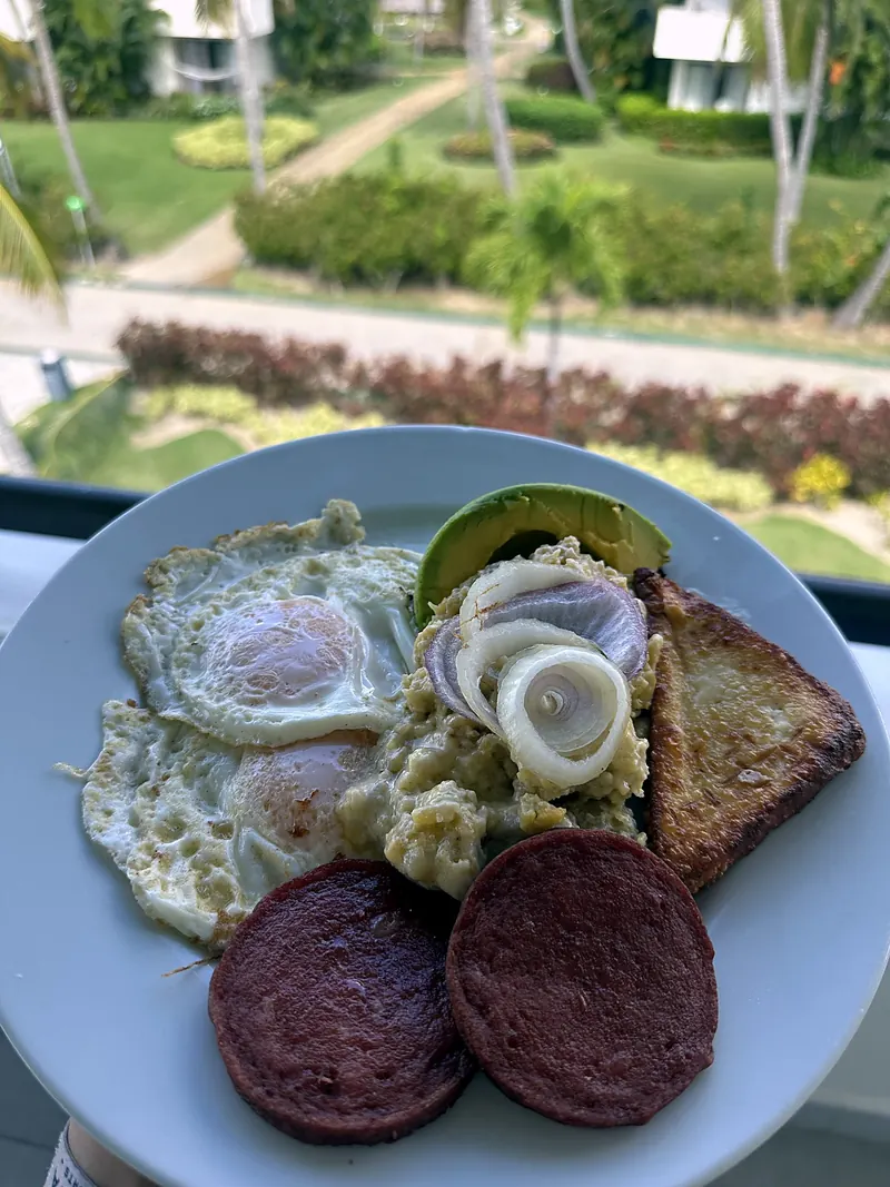 Mangu with fried eggs and salami (tres golpes), Dominican Republic