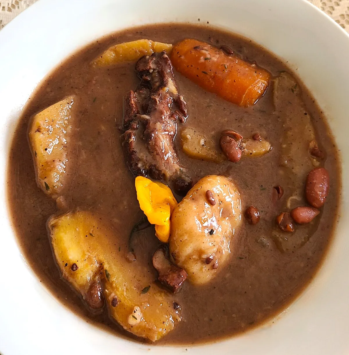 Jamaican red peas soup with dumplings, yam, and carrot