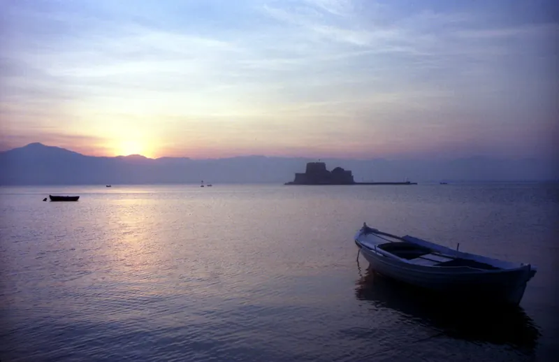 The Bourtzi fortress in Nafplio harbor at sunset