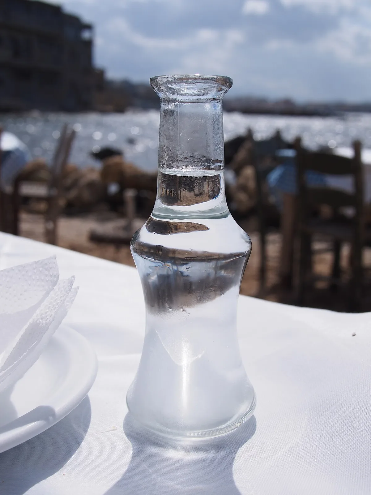 A frosted carafe of tsikoudia (raki) on a taverna table, Crete