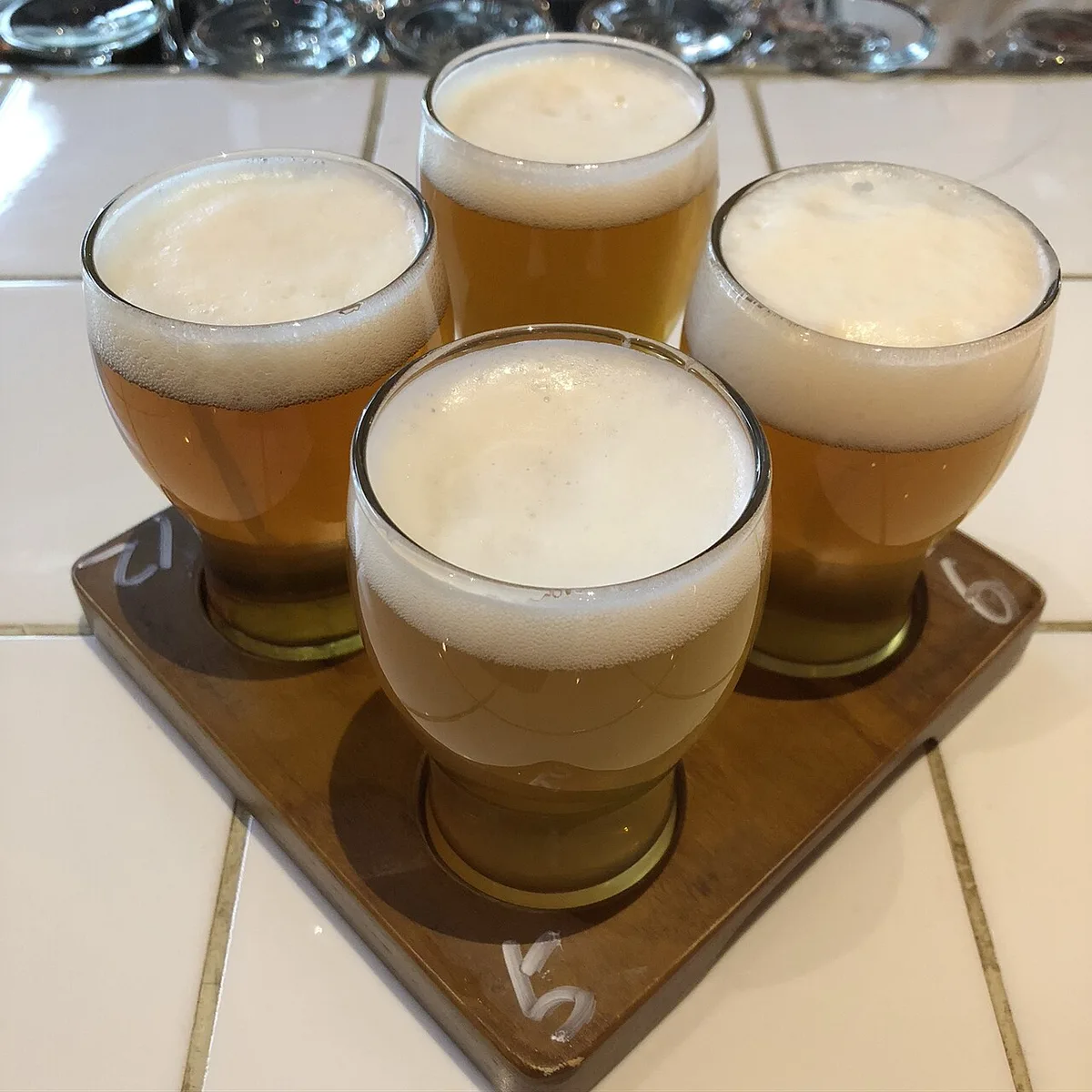 A flight of craft beers at a cervecería