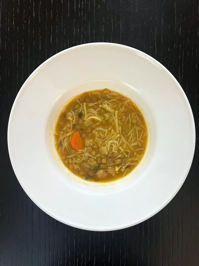 A bowl of harira soup with lentils, chickpeas and vermicelli