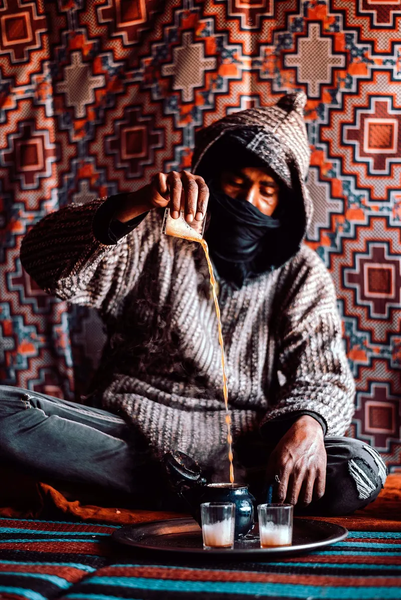 A camel herder preparing Sahraoui tea in the desert