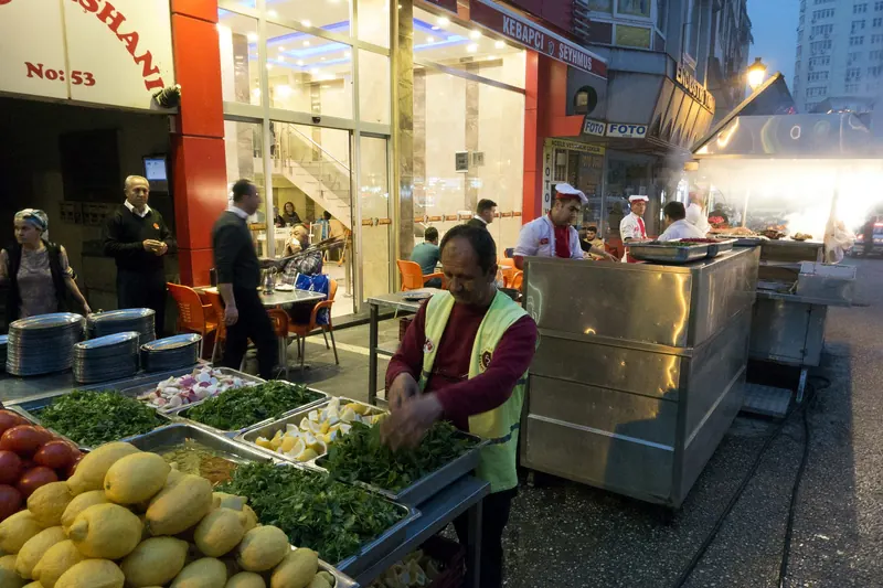 Adana kebap being prepared on the skewer