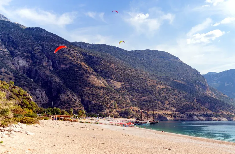 Tandem paragliding off Babadağ over the Blue Lagoon, Ölüdeniz