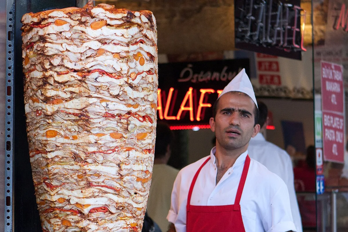 A döner stack with its usta at the shopfront