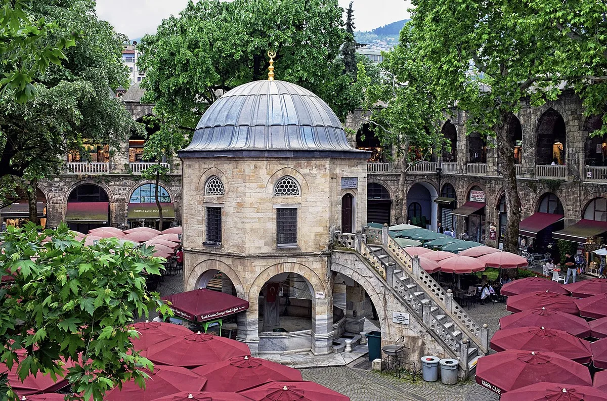Tea tables under the plane trees in the Koza Han courtyard, Bursa