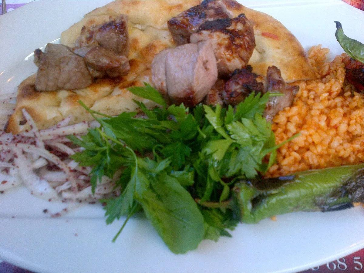 Kuzu şiş, lamb shish kebab, with rice and pickles