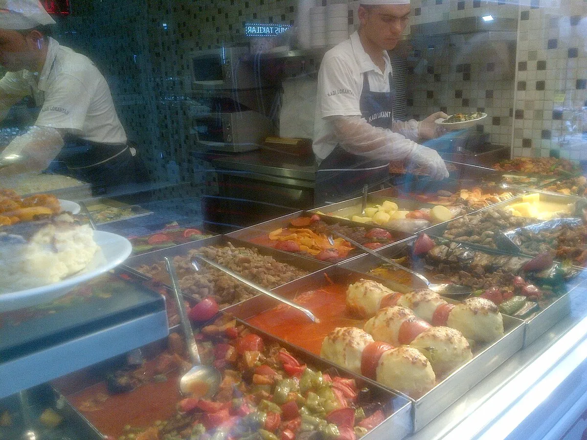 A lokanta steam-table counter at lunch service