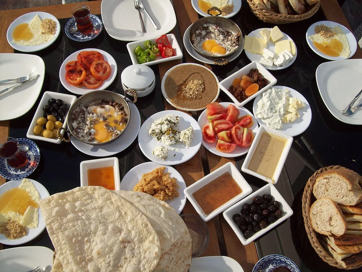 A Van breakfast spread: eggs, herbed cheese, kaymak and honey, olives and lavaş