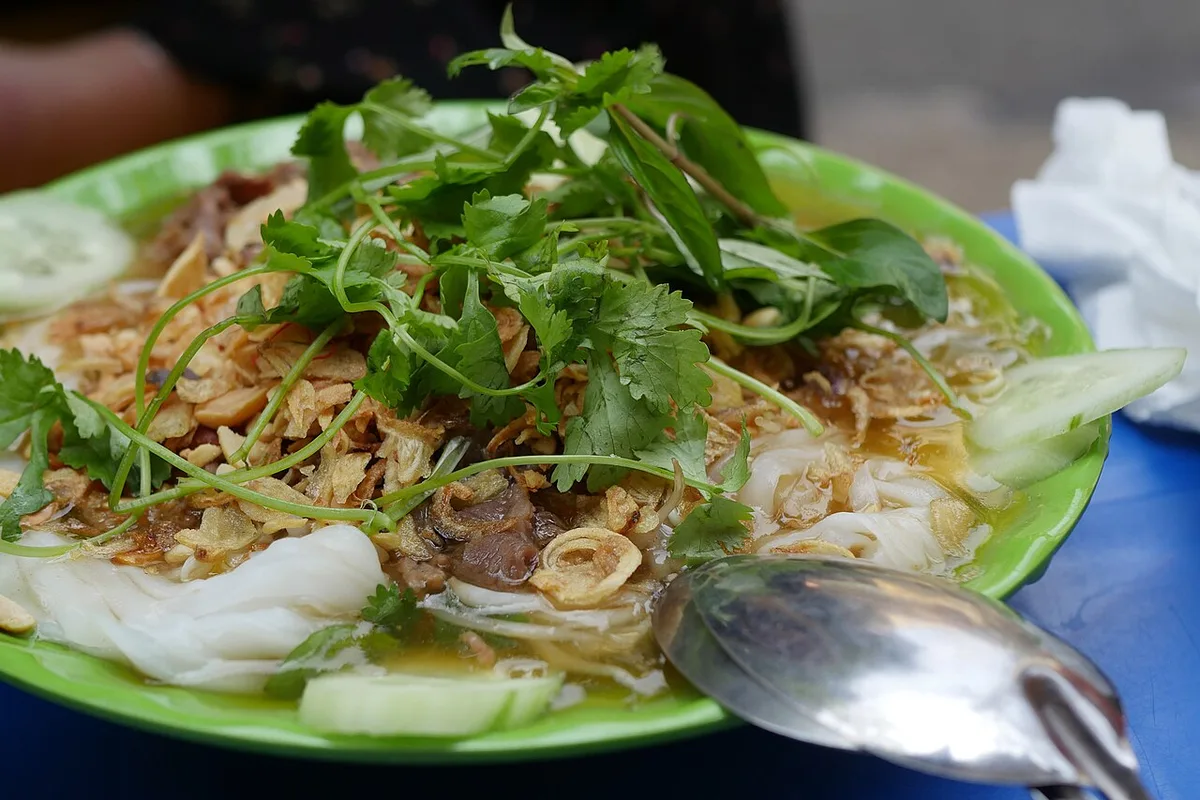 Banh cuon: steamed rice rolls with herbs and fried shallots, Hanoi style