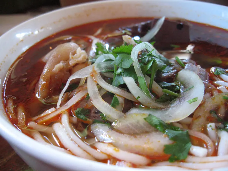 Bun bo Hue: thick round noodles in the deep-red lemongrass-and-chili broth