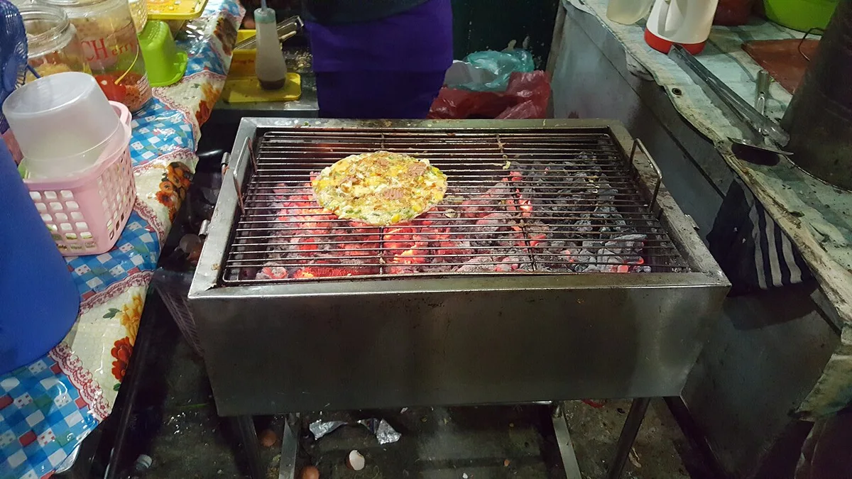 Banh trang nuong on the coals at Ho Thi Ky night market, Ho Chi Minh City